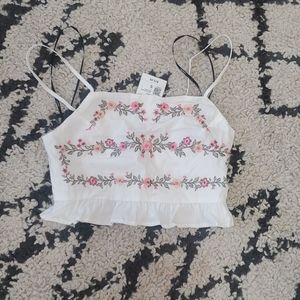 White woven top with embroidered flowers